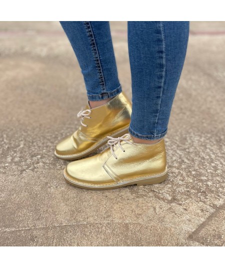Stellar boots in gold color